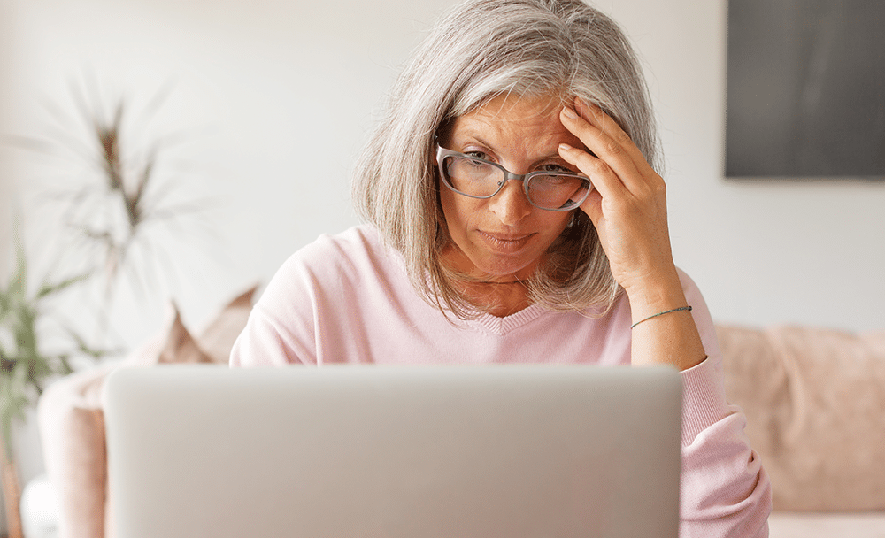 ae-fm-internal-2 an older woman gets frustrated while navigating a website