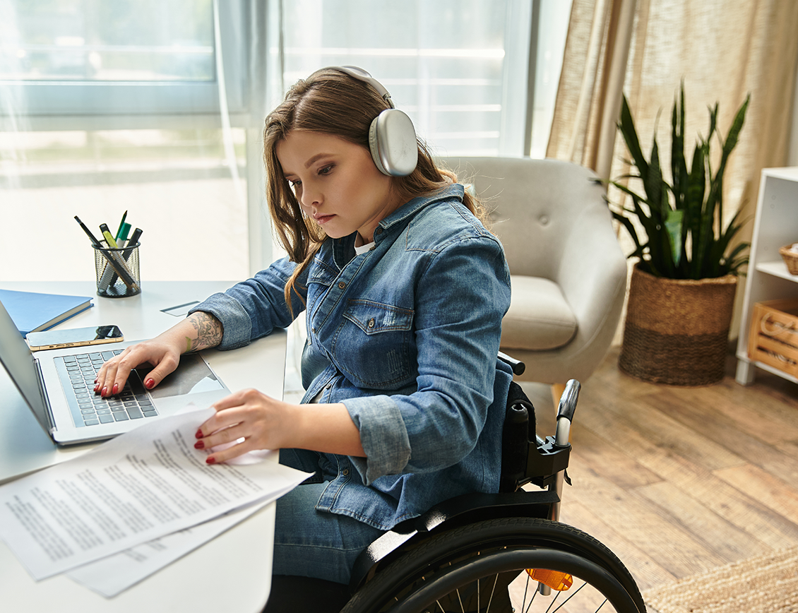 mixd-family-fund-new2 Mixd - Family Fund case study: girl in a wheelchair works at a desk.