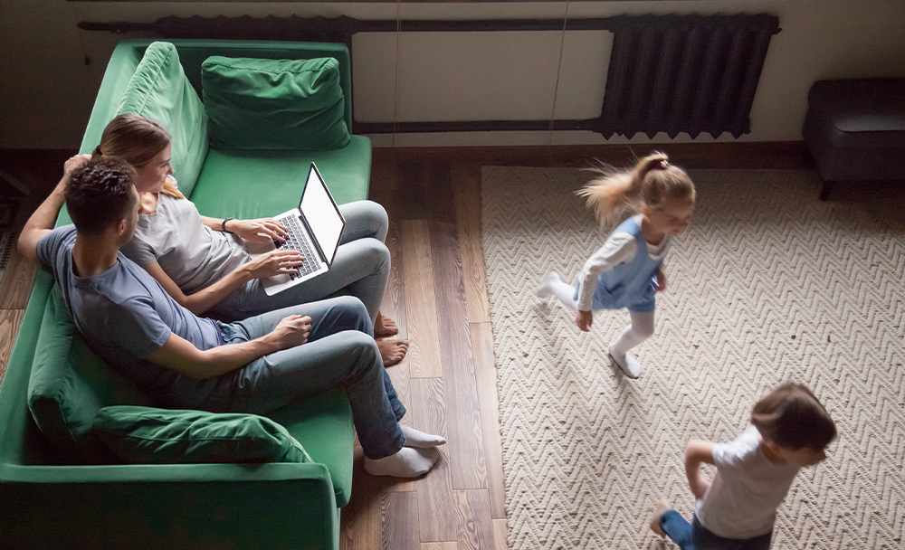 Mixd-FF2 Mixd - Family Fund case study: A family with children navigates a website using a laptop.